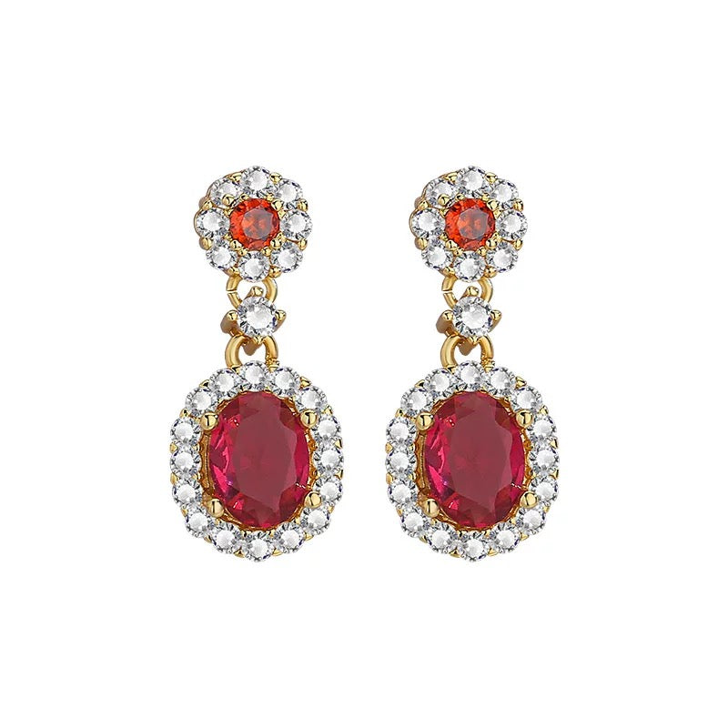Vintage-inspired ruby halo drop earrings in gold-plated sterling silver, oval red gemstones surrounded by white diamonds, Aeterna Jewelry product photo
