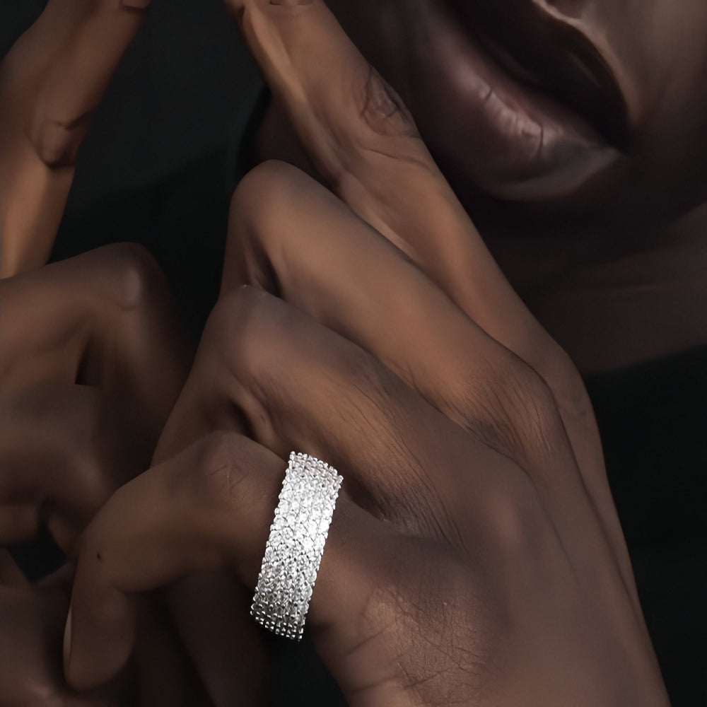 Aeterna Jewelry pavé diamond band ring worn by model’s hand in close-up view