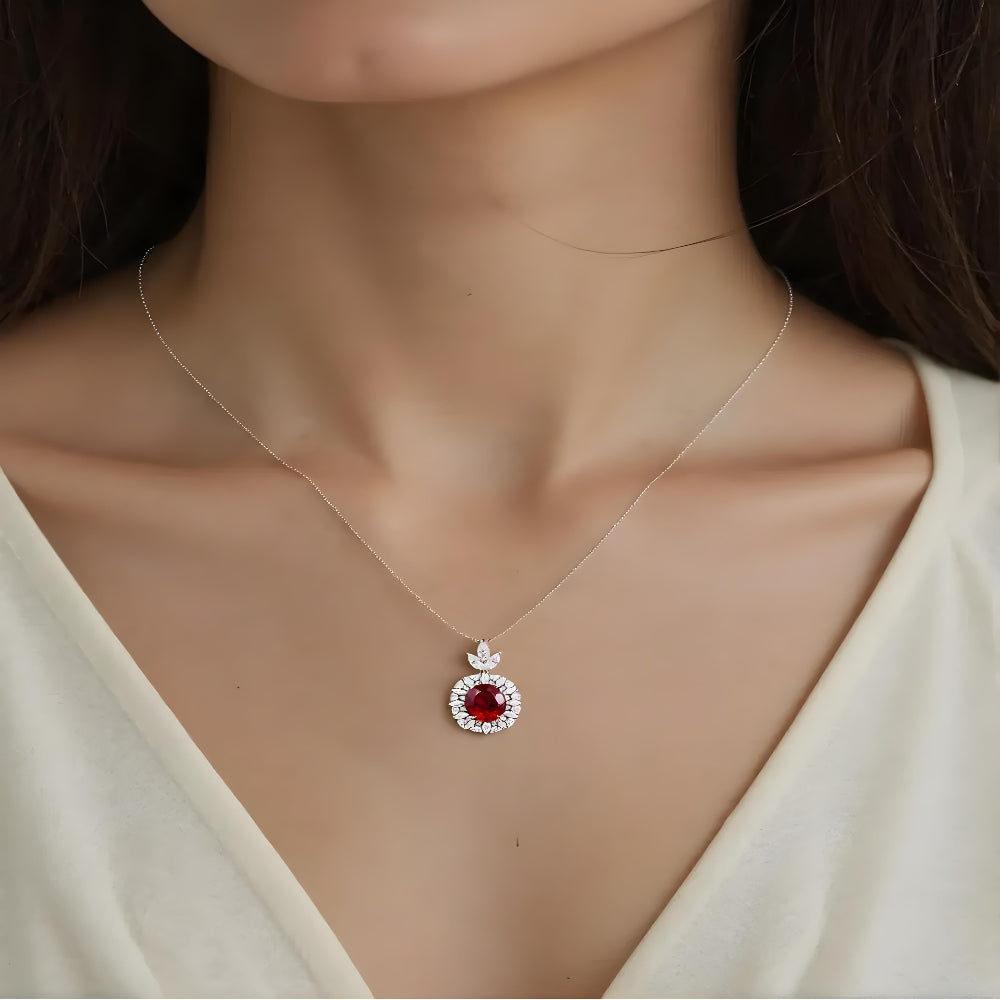 Aeterna Jewelry red ruby halo pendant necklace worn on model’s neckline
