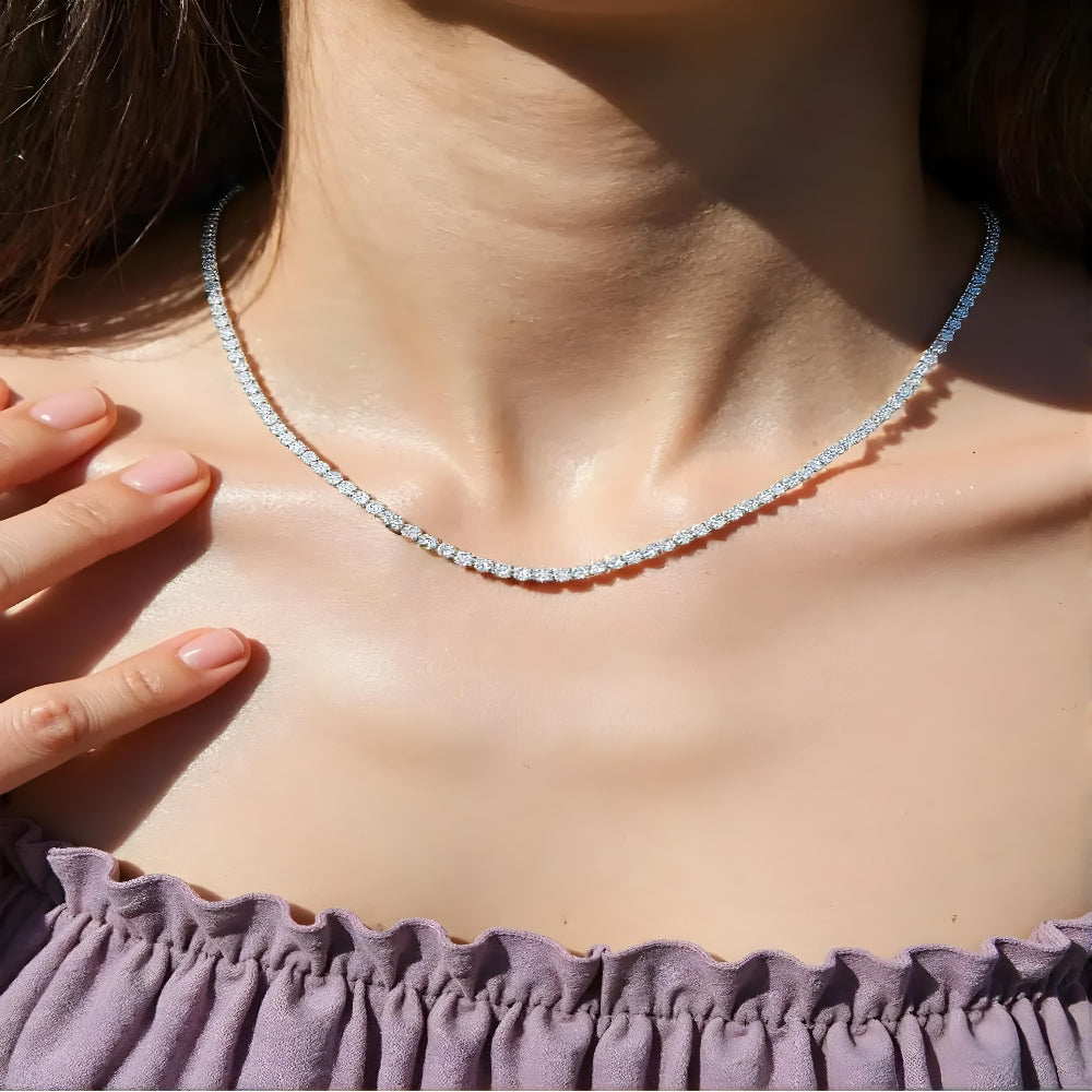 Aeterna Jewelry silver tennis chain necklace worn by female model under sunlight