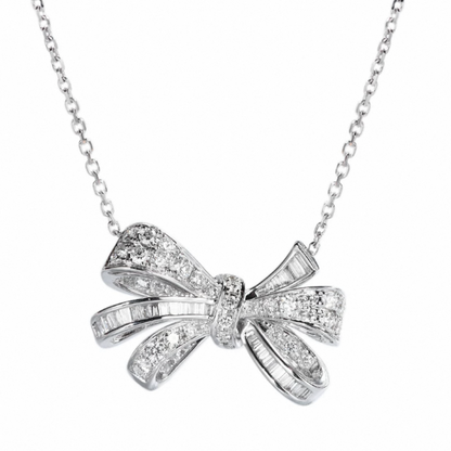 Detailed view of Aeterna Jewelry diamond bow necklace showing intricate pavé and baguette stone setting craftsmanship