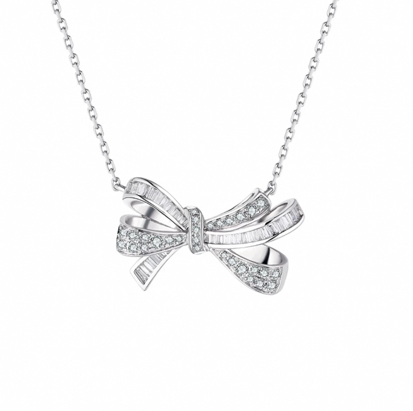 Elegant bow-shaped diamond pendant necklace in sterling silver by Aeterna Jewelry, refined modern minimalist design